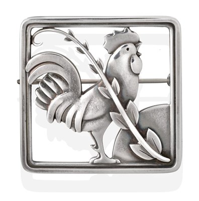 Lot 2020 - A Silver Brooch, by Georg Jensen, depicting a cockerel behind foliage within a square border,...