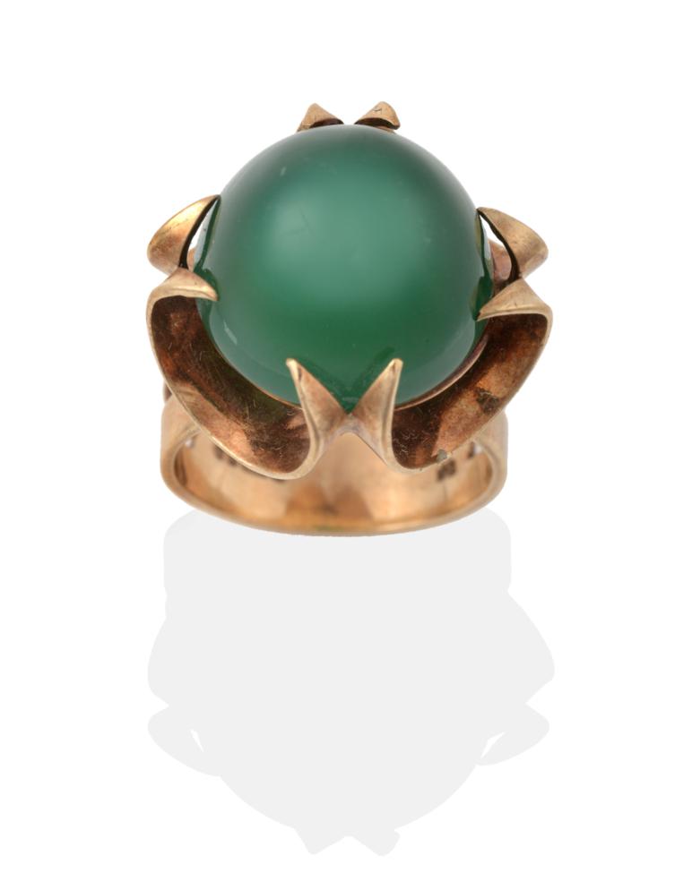 Lot 2028 - A 9 Carat Gold Green Chalcedony Ring, the cabochon green chalcedony in a fancy yellow claw...