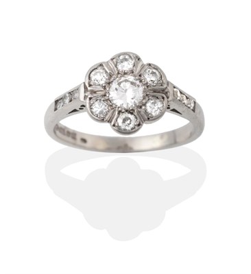 Lot 2040 - A Palladium Diamond Cluster Ring, the round brilliant cut diamonds in white claw settings, to...