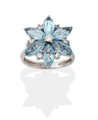 Lot 2041 - An Aquamarine and Diamond Cluster Ring, a round brilliant cut diamond centres a cluster of six...