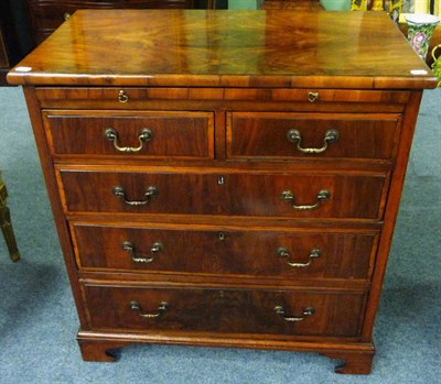 Lot 1538 - A George II Style  Walnut Straight Front Chest, the quarter-veneered top above a pullout...