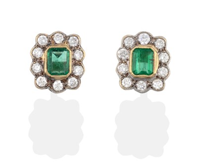 Lot 2070 - A Pair of Emerald and Diamond Cluster Stud Earrings, the emerald-cut emeralds in yellow collet...