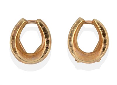 Lot 2071 - A Pair of 9 Carat Gold Horseshoe Earrings, with clip fittings, boxed by Boodle & Dunthorne see...