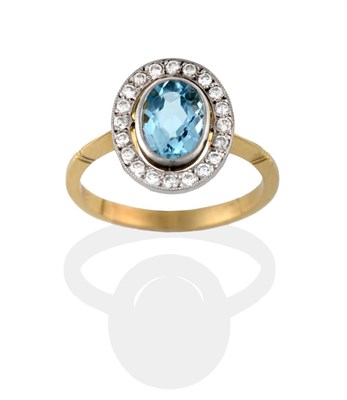 Lot 2084 - An Aquamarine and Diamond Cluster Ring, the oval cut aquamarine in a white rubbed over setting,...
