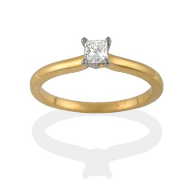 Lot 2092 - An 18 Carat Gold Diamond Solitaire Ring, the princess cut diamond in a white four claw setting on a