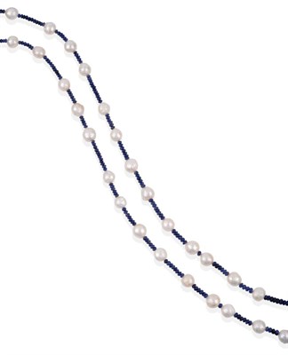 Lot 2110 - A Sapphire and Cultured Pearl Necklace, smooth roundel sapphire beads spaced by cultured...