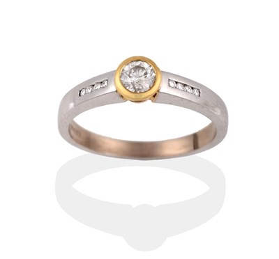 Lot 2118 - An 18 Carat Gold Diamond Ring, a round brilliant cut diamond in a yellow rubbed over setting,...