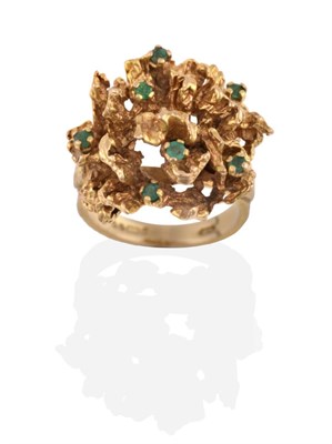 Lot 2138 - A 9 Carat Gold Emerald Ring, a textured top inset with round brilliant cut emeralds, to...