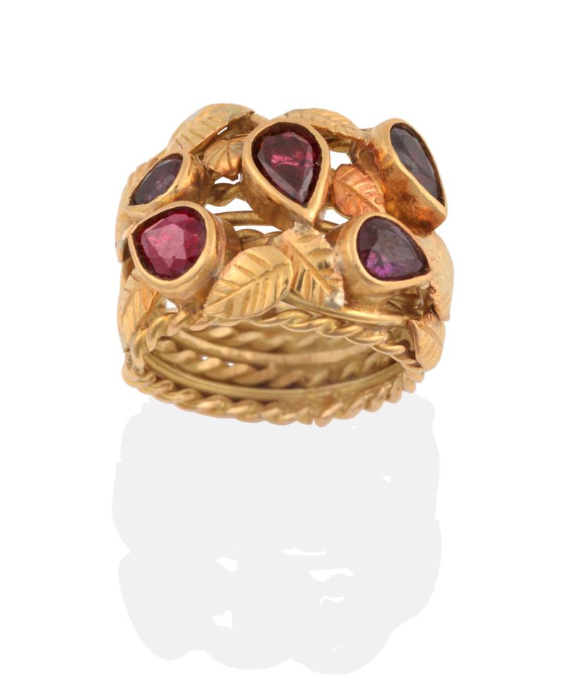 Lot 2139 - An 18 Carat Gold Ruby Ring, by Helen Newman, the broad ring of wire and twisted wire form, overlaid