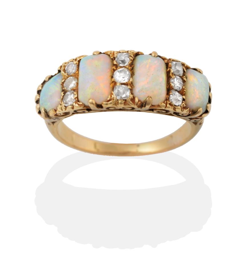 Lot 2153 - An Opal and Diamond Ring, four graduated oblong cabochon opals spaced by vertically set trios...