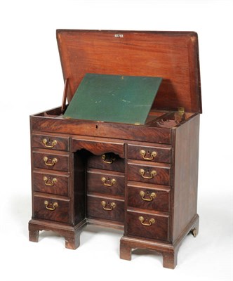 Lot 1550 - A George III Mahogany Kneehole Desk, 3rd quarter 18th century, the hinged top revealing a...