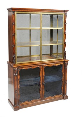 Lot 1555 - A William IV Rosewood and Parcel Gilt Display Cabinet, mid 19th century, the cavetto breakfront...