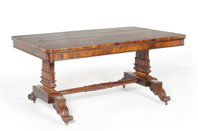 Lot 1558 - A William IV Rosewood Library Table, the rounded rectangular top raised on acanthus leaf carved end