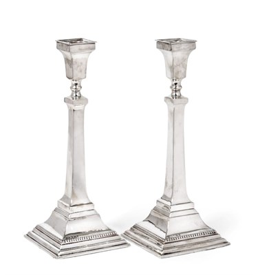 Lot 2254 - A Pair of George V Silver Candlesticks, by Britton, Gould and Co., Birmingham, 1932, on stepped and