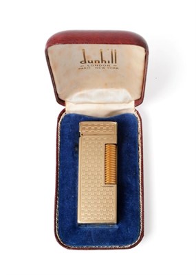 Lot 2292 - An Elizabeth II Gold Dunhill Cigarette Lighter, maker's mark HW, London, 1965, 9ct, retailed by...