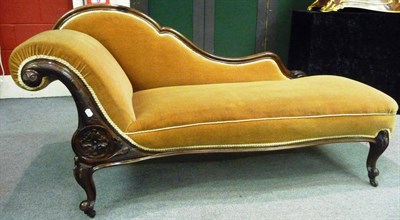 Lot 1573 - A Victorian Rosewood Framed Chaise Longue, 3rd quarter 19th century, upholstered in brown...