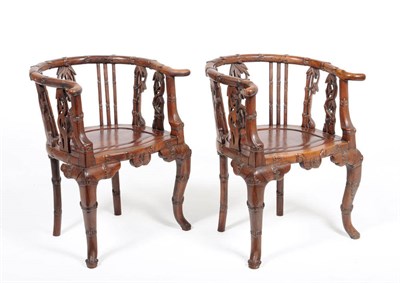 Lot 1580 - A Pair of Chinese Rosewood Open Armchairs, late 19th century, the frame carved as bamboo within...