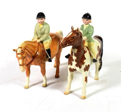 Lot 136 - Beswick Girl on Pony, model No. 1499, Skewbald gloss and Boy on Pony, model No. 1500, Palomino...