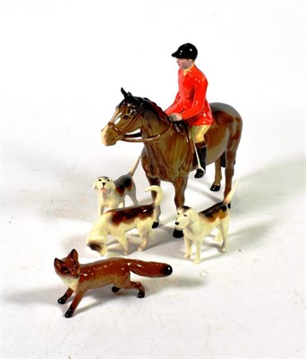 Lot 139 - Beswick Huntsman (Style Two: Standing), model No.1501, brown gloss, with a fox and three hounds (5)