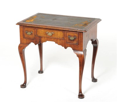 Lot 1590 - A George I Walnut Dressing Table, circa 1720, the rectangular moulded top above one long and...