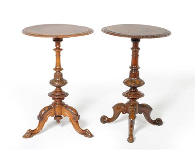 Lot 1598 - A Victorian Figured Walnut Pedestal Wine Table, late 19th century, the circular top with a leaf...