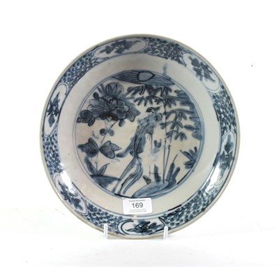 Lot 169 - A Swatow porcelain saucer dish, probably 17th century, painted in underglaze blue with a...