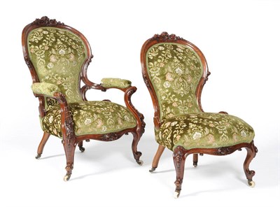 Lot 1607 - A Victorian Walnut Framed Open Armchair, 3rd quarter 19th century, upholstered in green floral...