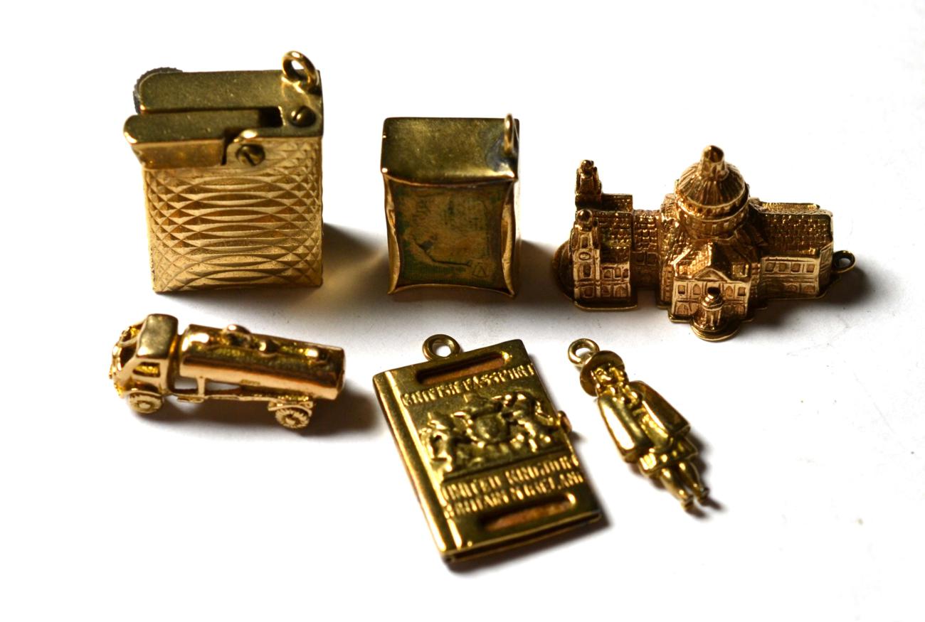 Lot 210 - Six 9 carat gold charms/pendants including a lighter, a passport, a tanker etc