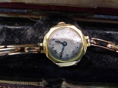 Lot 215 - Two picture lockets; a 9 carat gold smokey quartz ring, finger size M; and a lady's wristwatch...