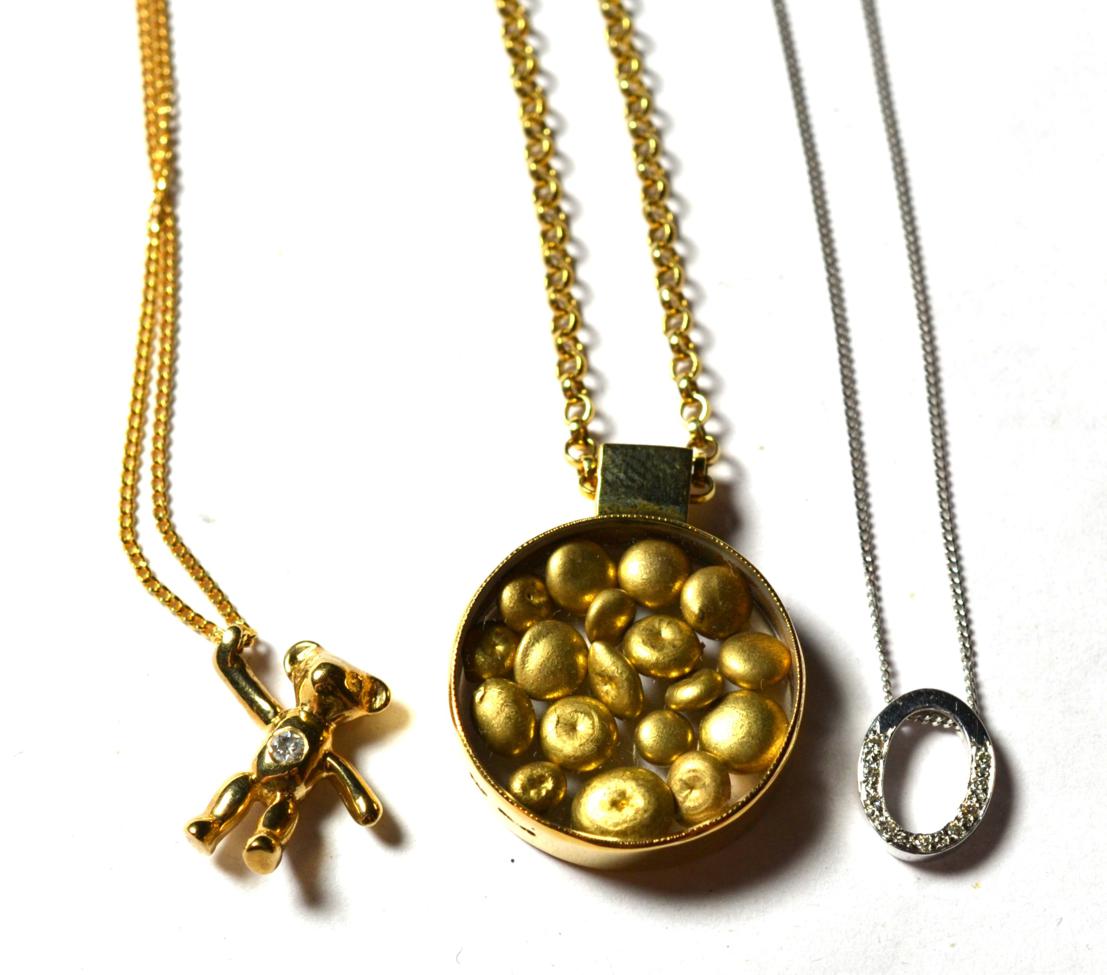 Lot 222 - A 9 carat gold nugget pendant on a 9 carat gold chain, pendant diameter 2cm, chain length 40cm; a 9