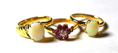 Lot 226 - A 9 carat gold ruby and diamond cluster ring, finger size O1/2; an 18 carat gold opal solitaire...