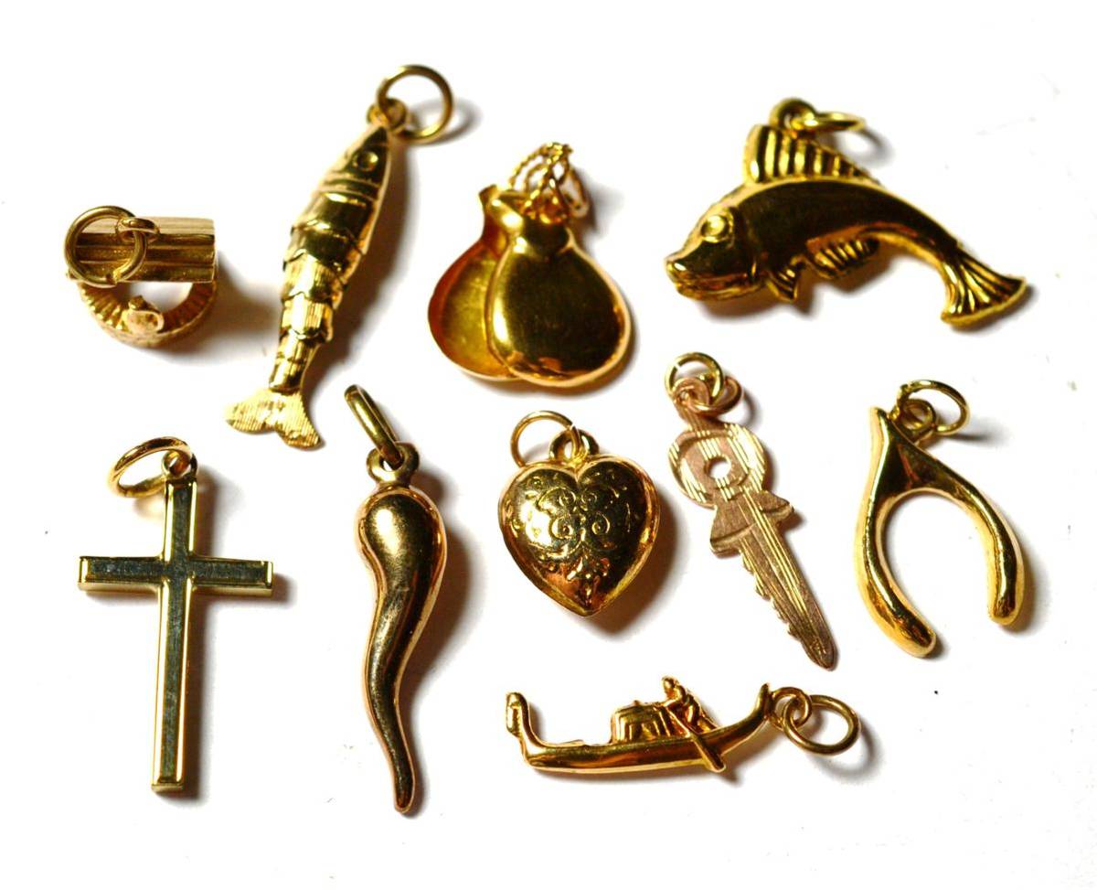 Lot 236 - Four 9 carat gold charms including a fish, a cross, a wishbone etc; two charms stamped '9CT'...