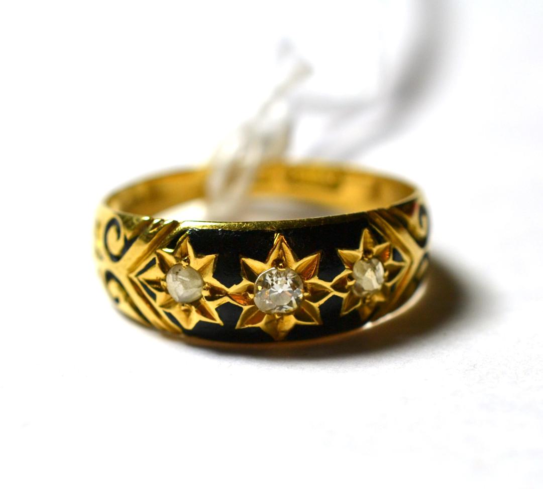 Lot 239 - An 18 carat gold black enamelled three stone mourning ring, finger size K1/2