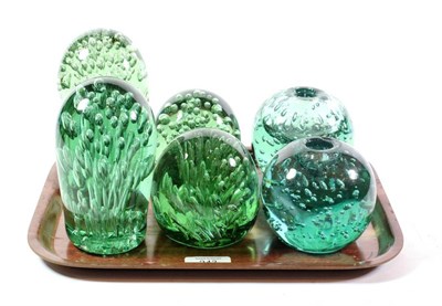 Lot 243 - A pair of Victorian Sunderland glass candle holders and four Sunderland dump paperweights