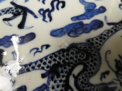 Lot 246 - A pair of Chinese porcelain blue and white dishes decorated with sages in a garden bearing Kang...