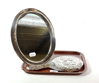 Lot 261 - A George V silver-mounted dressing-table mirror; maker's mark rubbed, Birmingham, 1922, oval...