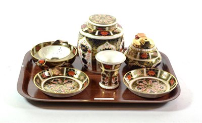 Lot 269 - A Royal Crown Derby ginger jar and cover, a table lighter, a tea strainer, a vase and two dishes
