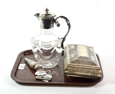 Lot 276 - A collection of white metal including a claret jug, ceylon box, scent bottle, cigar cutter and...