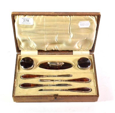 Lot 278 - A Stokes & Ireland Ltd silver and tortoiseshell manicure set, Chester 1927, in original case...