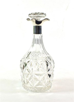 Lot 280 - A cut glass decanter with silver collar