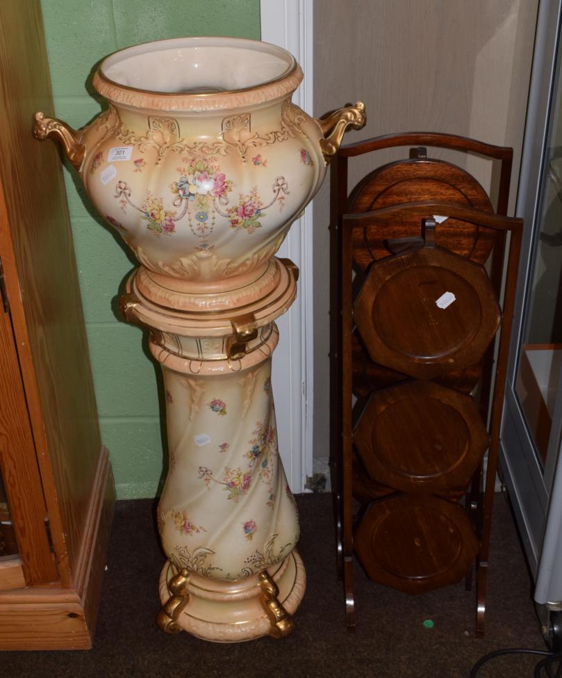 Lot 301 - A Crown Devon blush ivory decorated jardiniere on stand and two folding cake stands