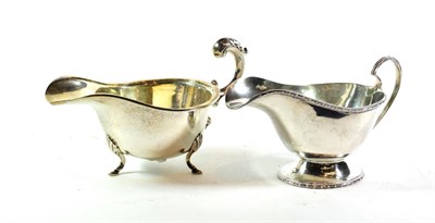 Lot 302 - Two George V silver sauceboats, one by Deakin and Francis, Birmingham, 1920, the other by...