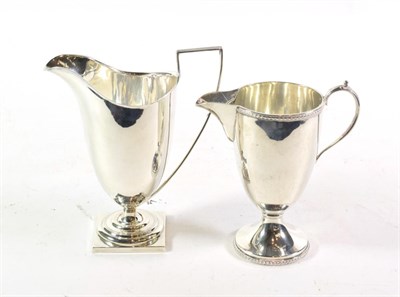 Lot 305 - Two George V silver cream-jugs, one by James Dixon and Sons, Sheffield, 1910, the other by G. Bryan
