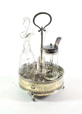 Lot 313 - A George III silver cruet-frame, circular and on three ball and claw feet, with openwork and...