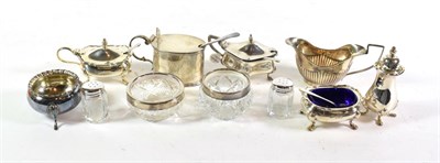 Lot 319 - A quantity of silver and silver-mounted condiment items, including: a three-piece condiment set...