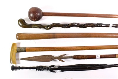 Lot 342 - A collection of various sticks including a knobkerrie, spear, silver collared walking stick etc (7)