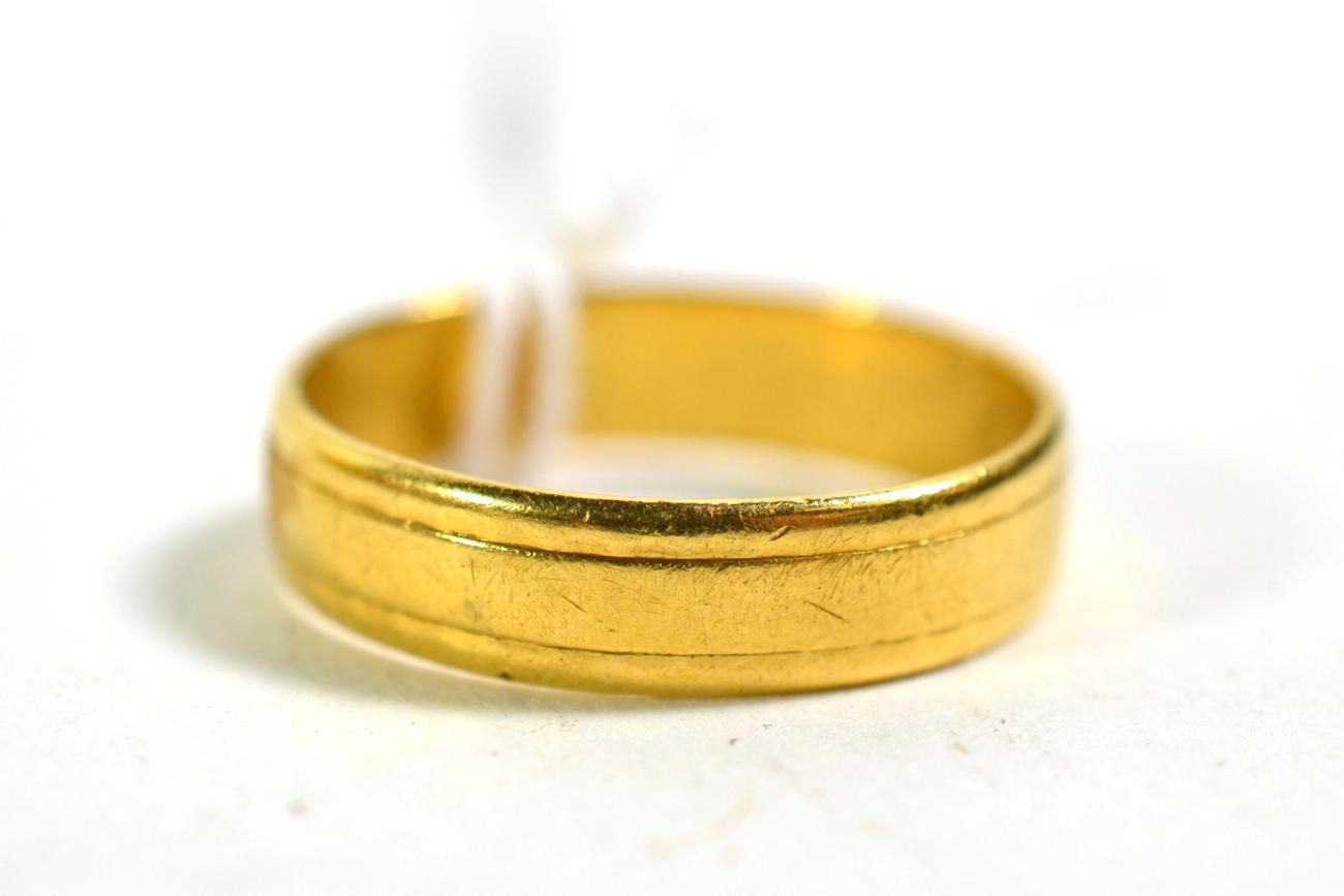 Lot 358 - An 18 carat gold band ring, out of shape