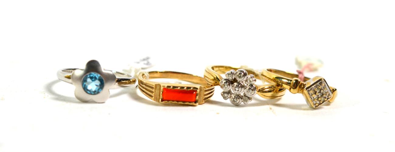 Lot 362 - A 9 carat white gold blue topaz ring, finger size N; two 9 carat gold diamond cluster rings, finger