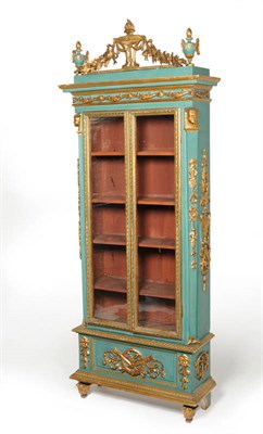 Lot 1627 - A Central European Carved Giltwood and Green Painted Bookcase, 19th century, the staged top...