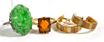 Lot 389 - A jade ring, stamped '18CT', finger size K1/2; a gem set ring, stamped '9CT', finger size L1/2; and